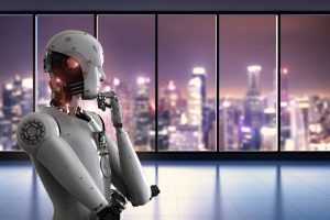 A humanoid robot crosses its arms with a fist to its chin, seemingly considering the cityscape through the windows behind it.