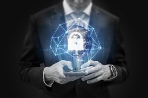 A man in a suit holds a smartphone. Above it a lock and connection graphics are overlaid over a globe.